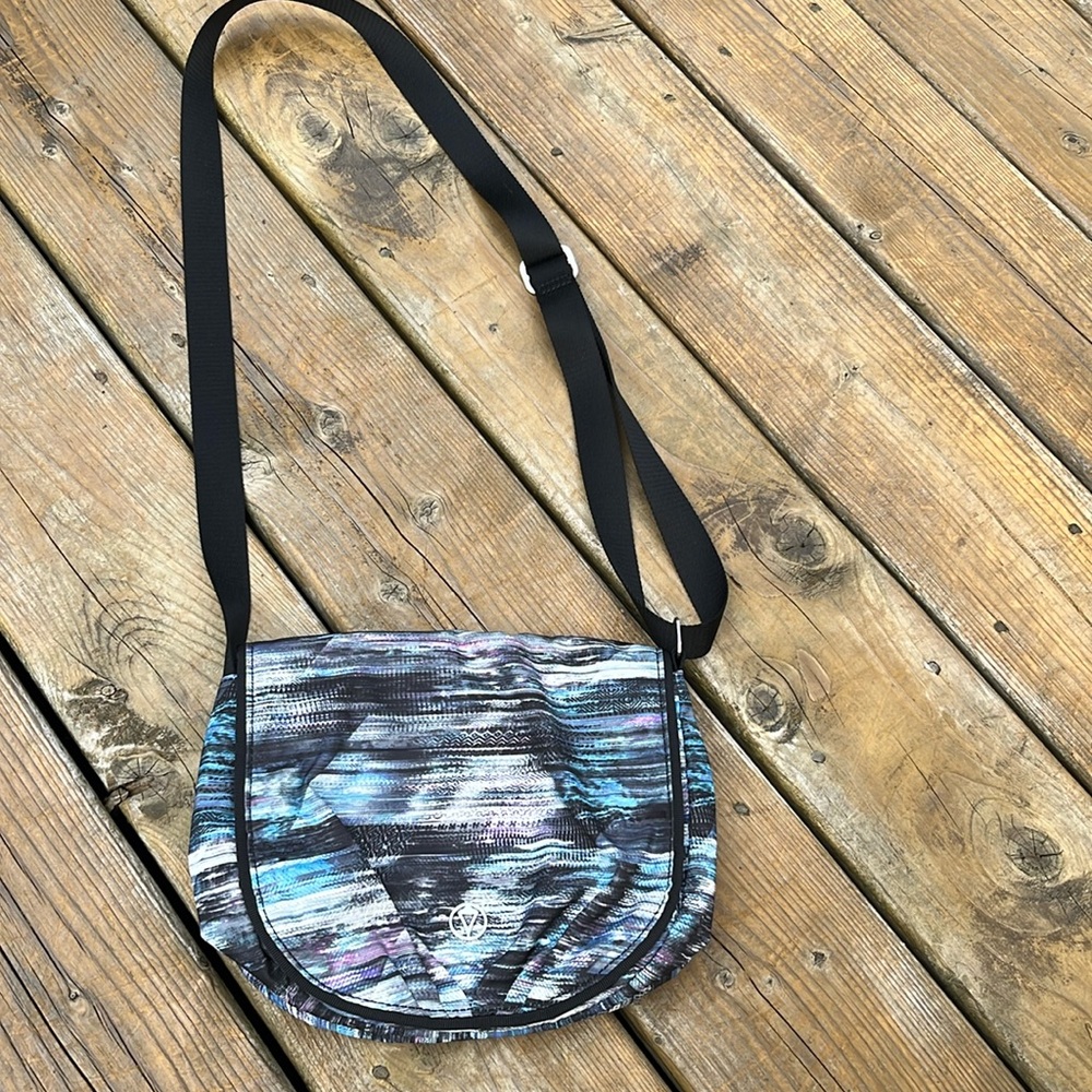 - Ivivva cross body bag with an adjustable strap